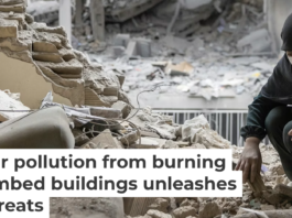 A woman sifts through the rubble in her home after it was damaged by a missile on March 15, 2026, in Tehran. Majid Saeedi/Getty Images